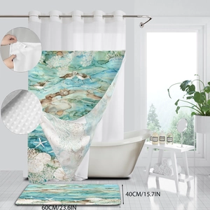 Detail of beach themed shower curtain and bath mat set with shell and starfish patterns