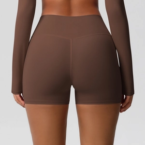 Macro view of high-waist yoga shorts showing the push-up effect and seamless stitching