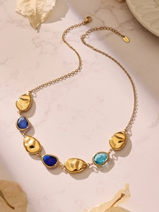Macro view of blue gemstone necklace with 18k gold plated stainless steel lobster clasp