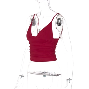 Detail view of the red crop top camisole featuring side drawstring ruched accents