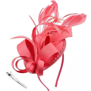 Close-up of rose red feather fascinator with satin ribbon and detachable metal hair clip