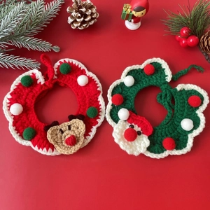 Flat lay of knit Christmas pet collars with reindeer and Santa motifs on red background
