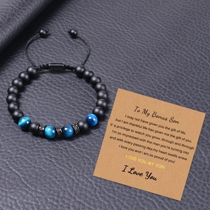 Matte tiger eye beaded bracelet with bonus son gift card on black leather surface