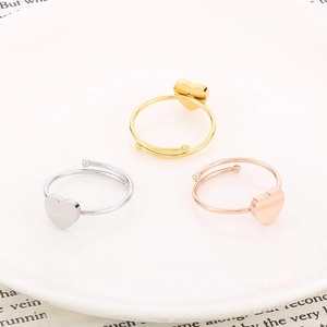 Three-piece set of minimalist heart open rings in gold, silver, and rose gold finishes