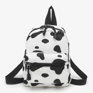 Cute cow print mini canvas backpack for women with front zipper pocket and cow pattern