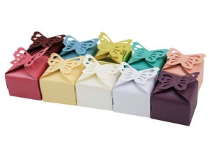 Macro shot showing hollow butterfly paper favor boxes in various pearlescent colors