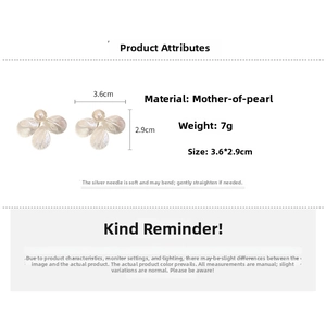 Macro detail of faux shell flower earrings with pearl center and 3.6cm size dimensions