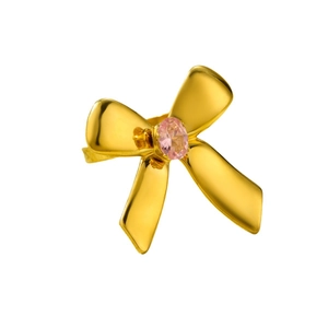 Polished gold bow ring featuring a central pink oval zircon on a clean white background