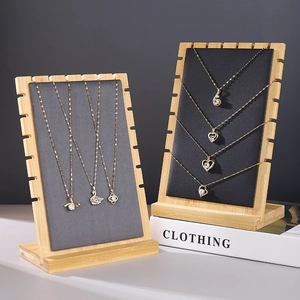 Minimalist bamboo necklace display stand with leather padding in black and grey