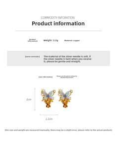 Detail view of 18k gold plated butterfly clip earring with blue zircon and copper material