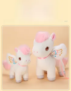 Detailed view of plush unicorn toys with pink mane and colorful embroidered wings