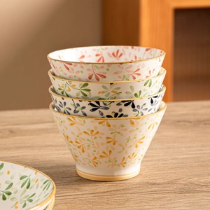 Japanese style stackable floral ceramic rice bowls with gold rim and cone shape design