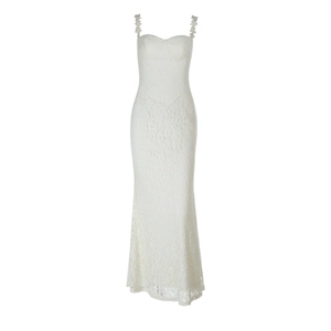 Detailed close-up of white lace texture and double straps on a slim fit maxi dress