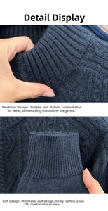 Detail of navy blue cable knit sweater featuring a stand collar and ribbed sleeve cuffs