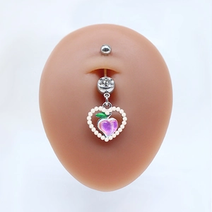 Detail of peach belly button ring with pearl heart frame and pink peach charm pendant