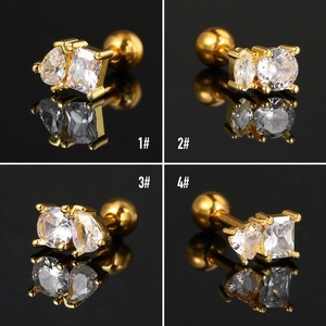 Four pairs of gold geometric zircon ear studs with screw ball backs in a quad display