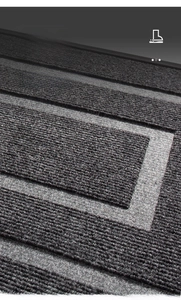 Macro detail of anti-slip striped rubber mat featuring 3D grooves for dust removal