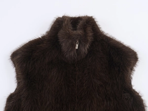 Detail of dark brown faux fur vest with a stand collar and silver metal zipper closure