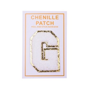 Detail of self-adhesive white chenille letter G patch with gold glitter borders