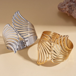 Chic hollow wing open bangles in gold and silver metal finishes with spring hinge detail