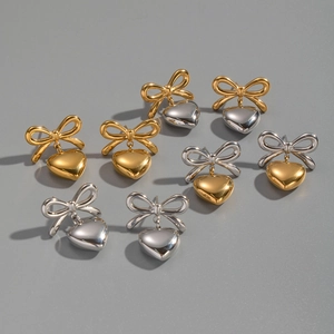 Macro display of assorted heart and bow earrings in gold, silver, and mixed metallic tones