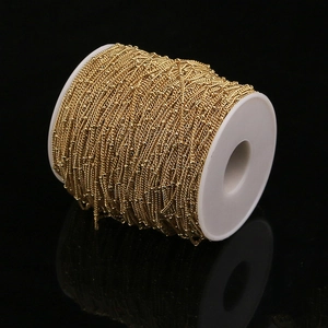 Golden stainless steel bead chain on white spool for DIY jewelry making accessories
