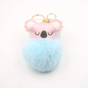 Pink faux leather koala keychain with light blue fluffy faux fur ball and gold clip