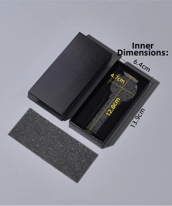 Detailed view of black rectangular gift watch box with foam insert and fabric texture