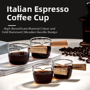 Detailed macro view of heat-resistant glass espresso cup with long wooden handle