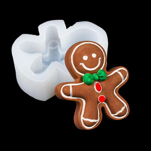 Καλούπι σιλικόνης ανθρωπάκι gingerbread για χριστουγεννιάτικα κεριά σε μαύρο φόντο