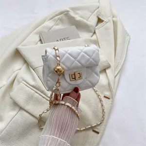 Mini quilted crossbody bag in white faux leather with gold chain and spherical charm