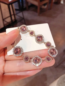 Detail of 925 silver bracelet with pink square crystals and rose gold finish
