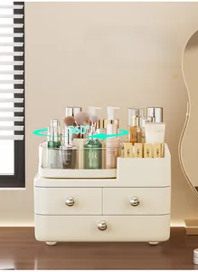 Detail view of cream desktop organizer showing 360-degree rotating tray and tiered drawers