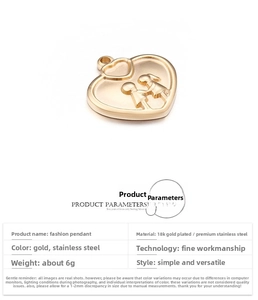 Detail of 18K gold plated heart pendant with engraved couple motif on stainless steel