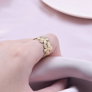 Gold stainless steel floral open ring featuring a brushed texture and flower petal design