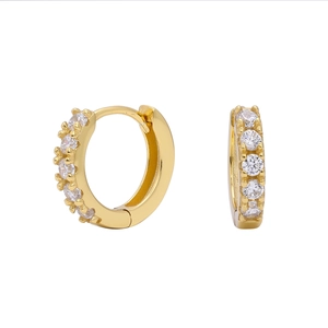 Macro shot of gold S925 sterling silver hoop earrings with sparkling zircon inlay