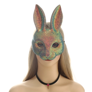Close-up of iridescent sequin bunny mask with long ears and metallic colorful glitter