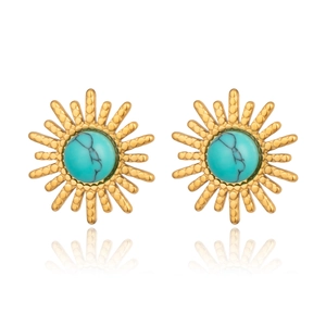 Detailed view of gold sunburst earrings with inlaid turquoise stones on white background
