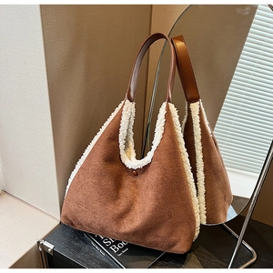Detail of contrast tote bag with brown faux suede and white faux fur trim on handles