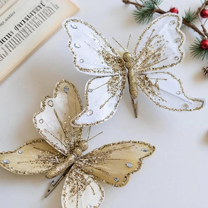 Sparkling gold glitter butterfly clips with white fabric wings and rhinestones for Christmas