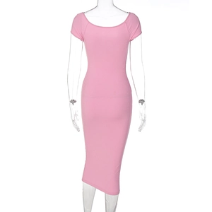 Detail view of the pink ribbed knit fabric and mid-calf length hem on the slim dress