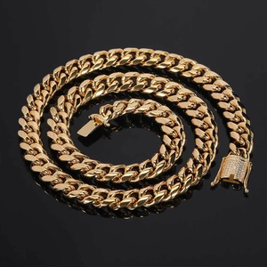 Men's 12mm gold-plated Cuban link necklace with iced-out diamond clasp on black surface
