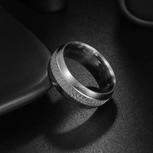 8mm silver men's wedding band featuring a brushed matte texture on a dark background