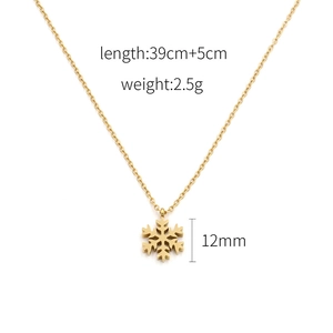 Detailed view of 18k gold snowflake pendant necklace with dimensions and weight specs