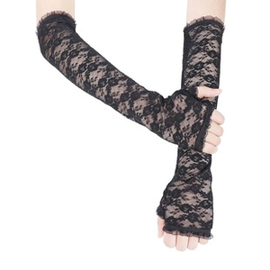 Close-up of black lace fingerless long gloves with floral patterns and ruffled edges
