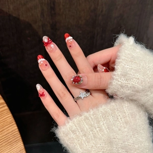 Handmade Christmas red press-on nails with 3D butterfly bows and pearls display