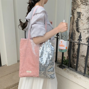 Detail of glittery pink velvet and silver sequin patchwork on a large tote bag