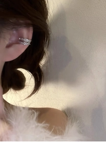 Detailed view of silver double-layered ear cuff with sparkling zircon inlay for women