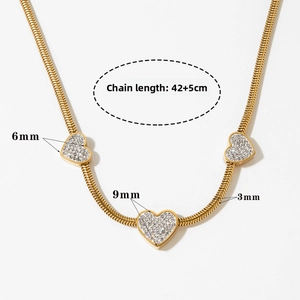 Detailed specs of gold snake chain necklace with sparkling zircon heart pendants