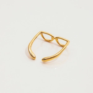 Macro view of adjustable 18K gold stainless steel ring featuring retro sunglasses design